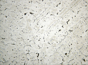 Stainless steel microstructure after proper etching, showing grain boundaries and structure at magnification